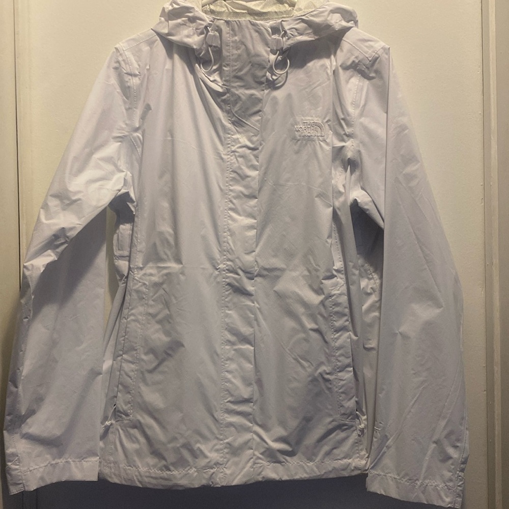 White North face wind breaker